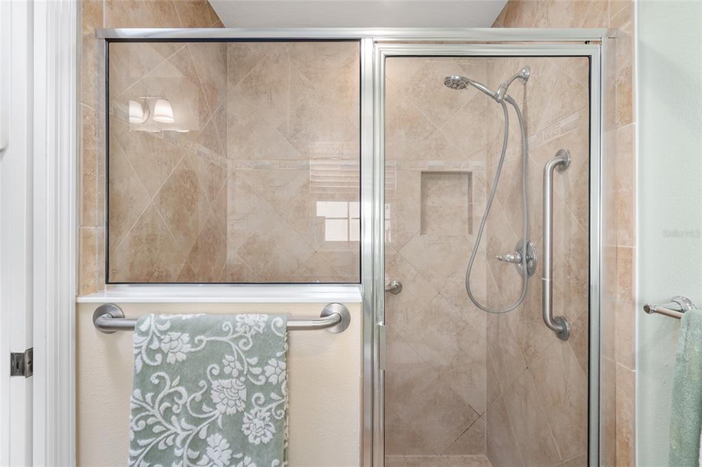 2053 Beecher Path The Villages, FL 32162 - Photo 30 of 44 a bathroom with a shower and a mirror