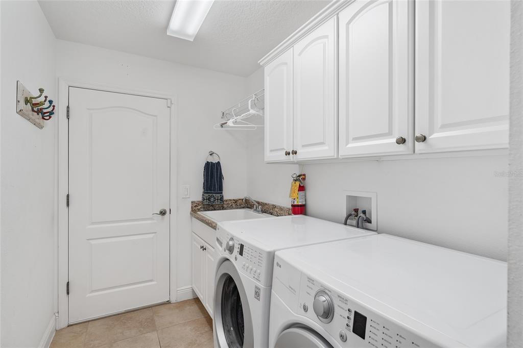 2053 Beecher Path The Villages, FL 32162 - Photo 36 of 44 a utility room with dryer and washer