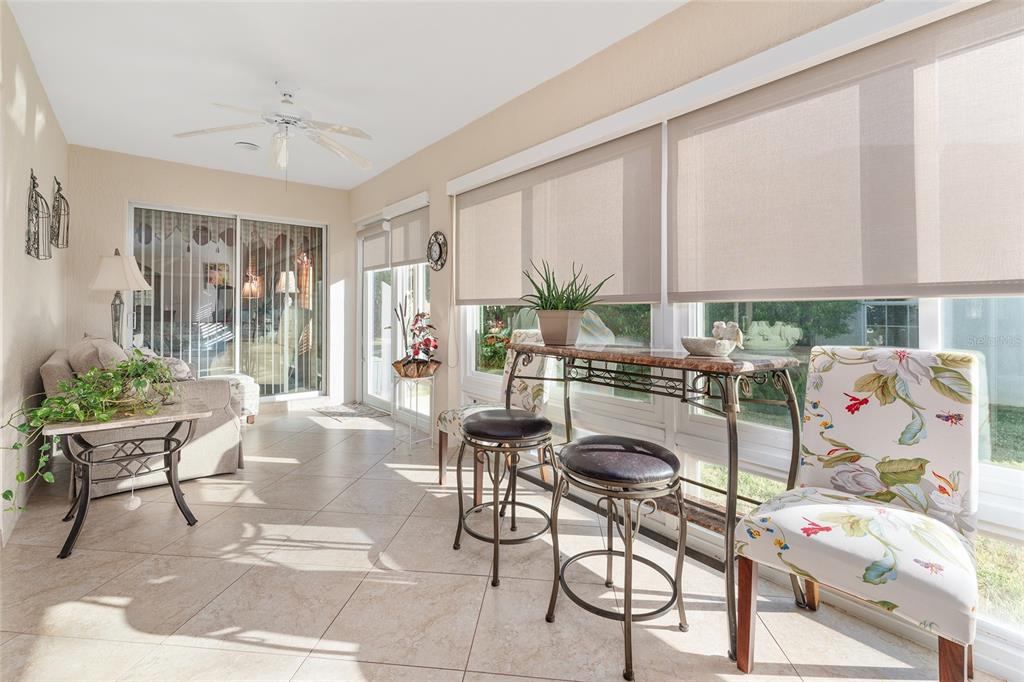 2053 Beecher Path The Villages, FL 32162 - Photo 38 of 44 a living room with furniture and a large window