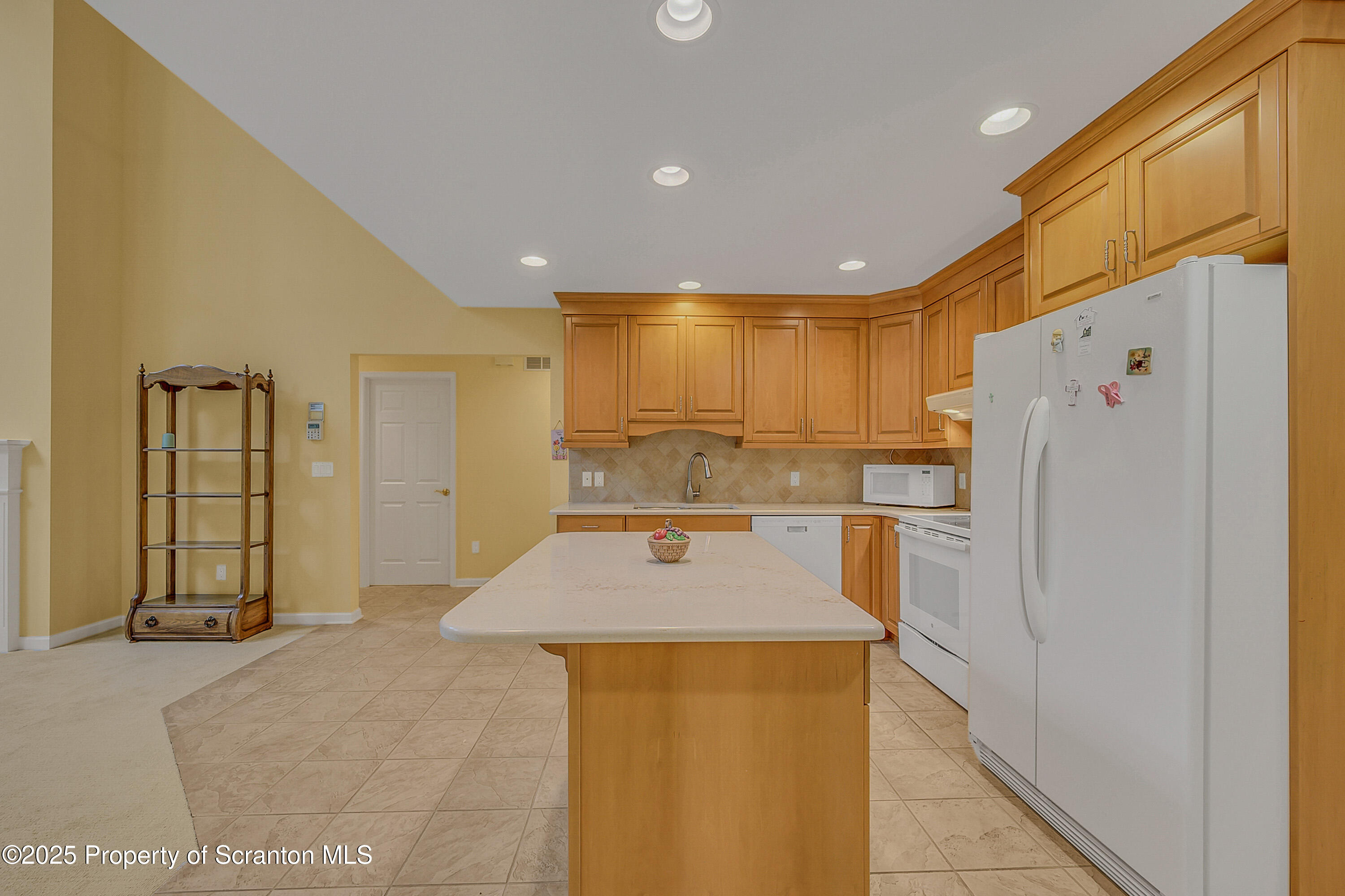 83 Hedge Row Run Clarks Summit, PA 18411 - Photo 10 of 49 a kitchen with stainless steel appliances granite countertop a refrigerator a sink and a stove