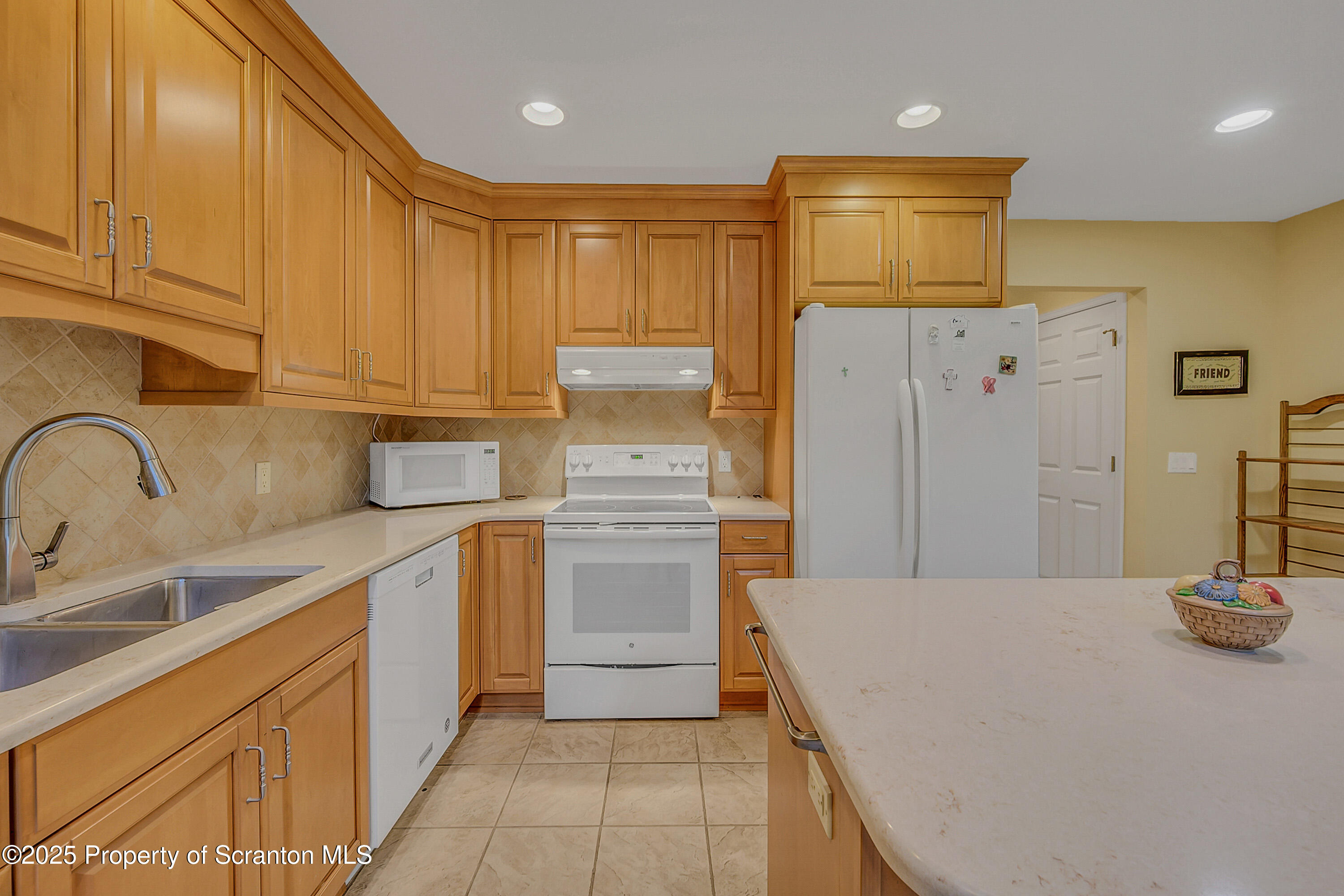 83 Hedge Row Run Clarks Summit, PA 18411 - Photo 12 of 49 a kitchen with stainless steel appliances a refrigerator and sink