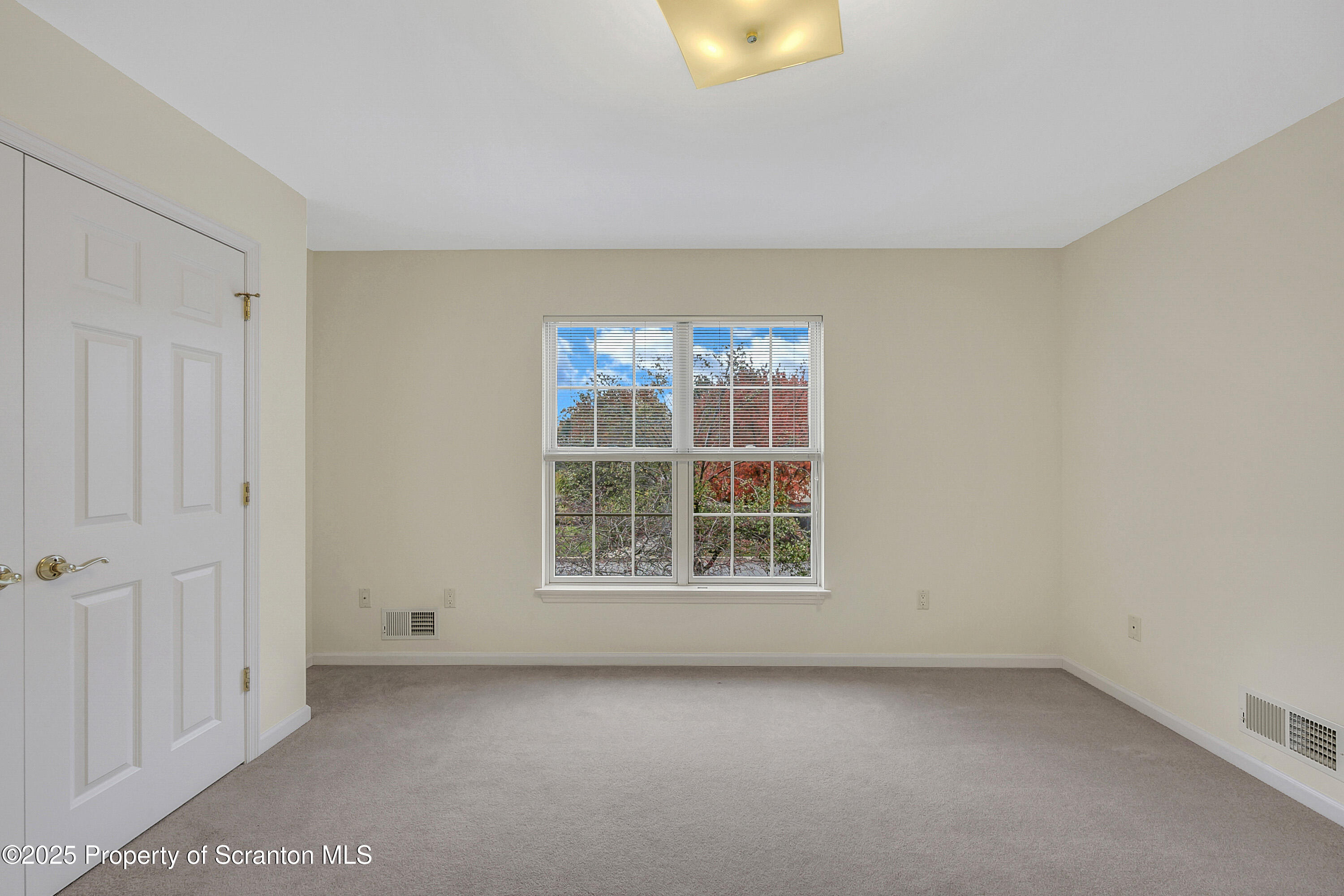 83 Hedge Row Run Clarks Summit, PA 18411 - Photo 33 of 49 an empty room with a window