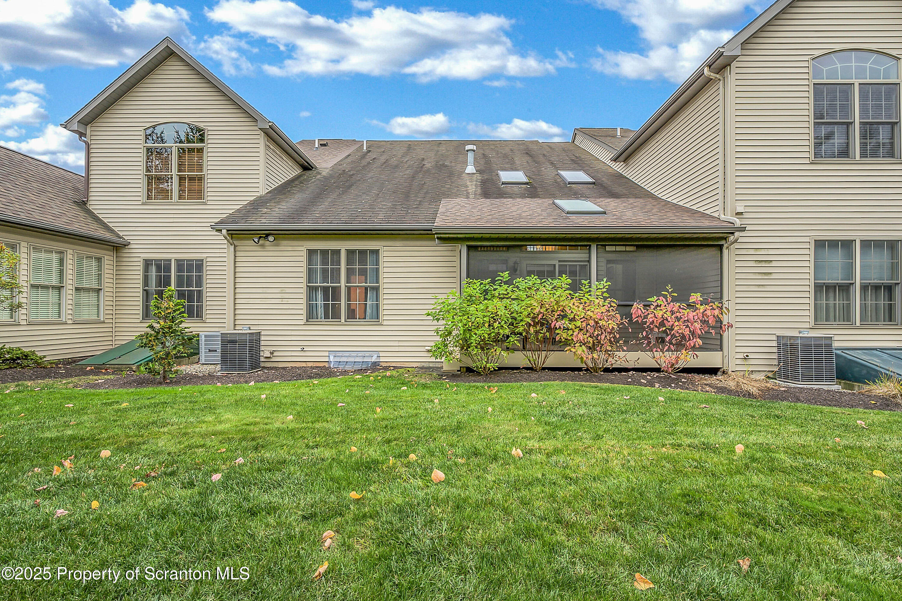 83 Hedge Row Run Clarks Summit, PA 18411 - Photo 4 of 49 a front view of a house with a garden