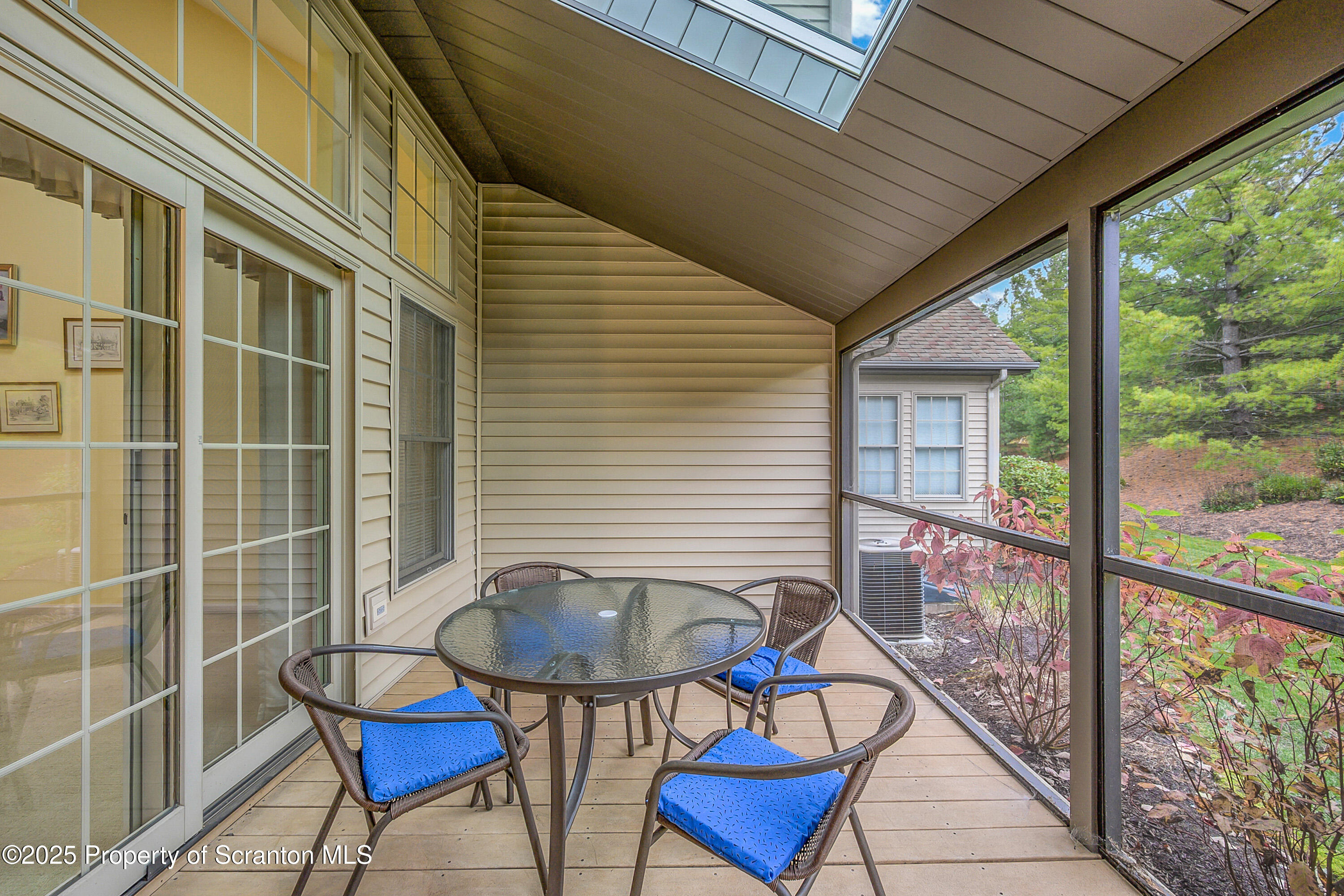 83 Hedge Row Run Clarks Summit, PA 18411 - Photo 38 of 49 a backyard of a house with table and chairs