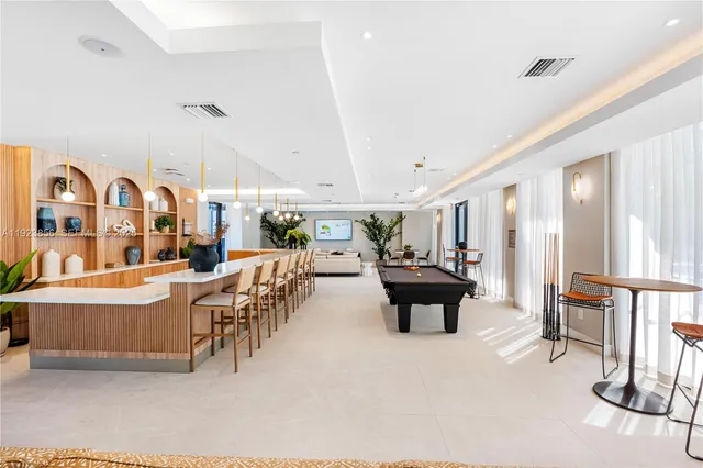 a living room with lots of furniture and white walls