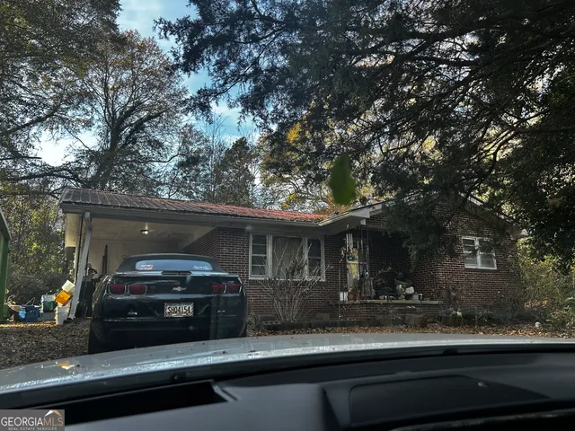 a view of a car parked in front of a house
