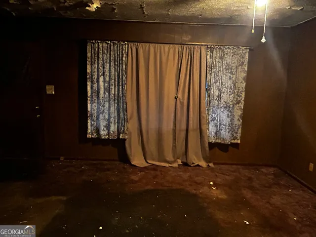 a view of water heater room with a window