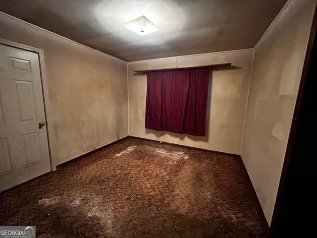 an empty room with a door