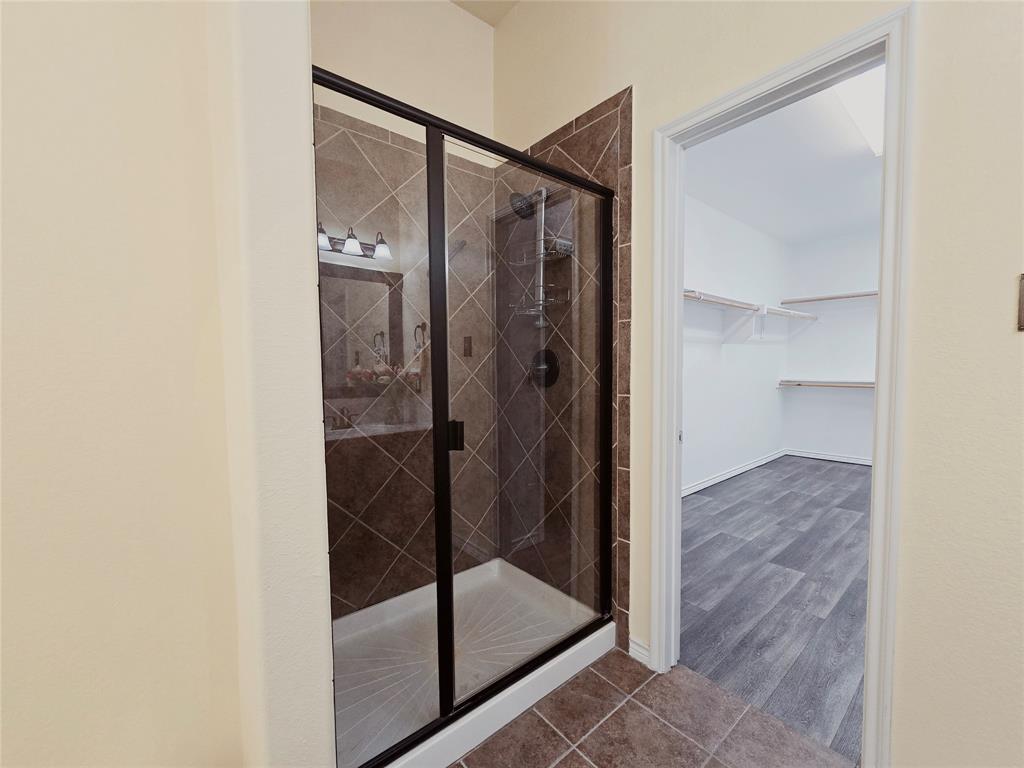 1800 Lancaster Gate Allen, TX 75013 - Photo 11 of 20 a bathroom with a glass shower door