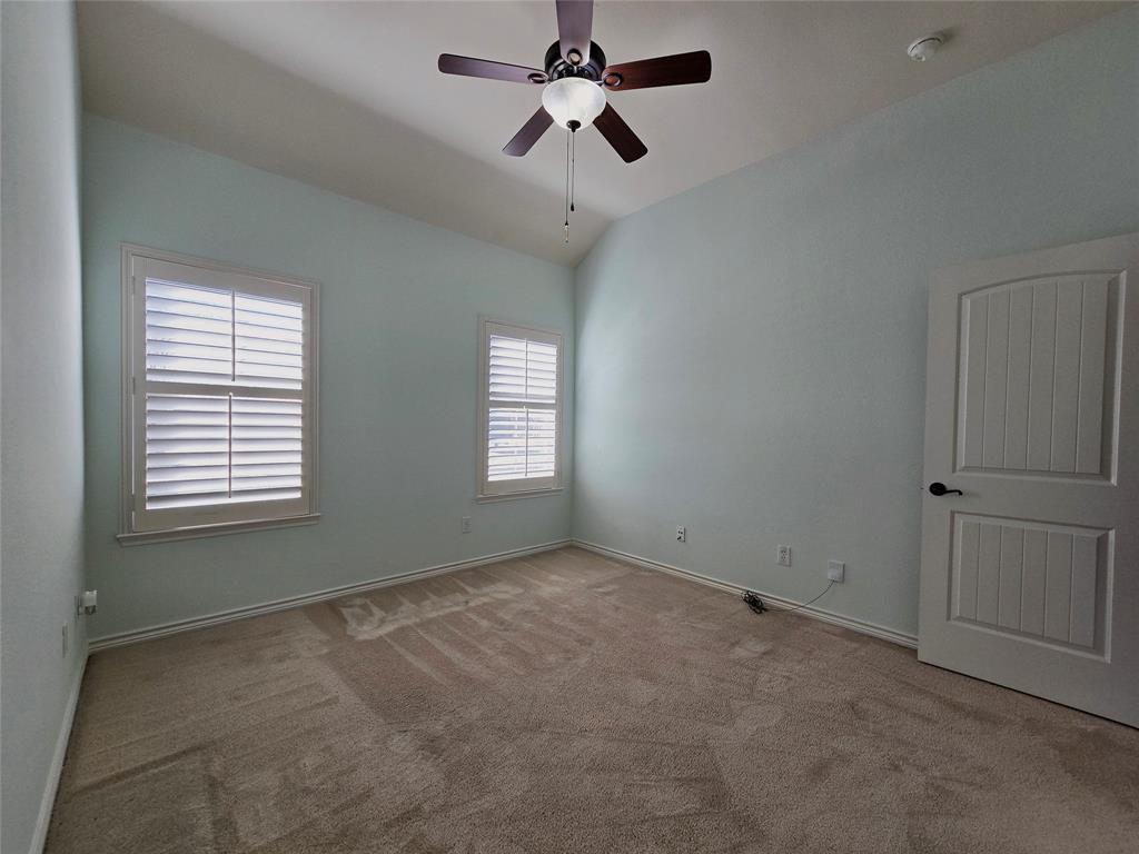 1800 Lancaster Gate Allen, TX 75013 - Photo 13 of 20 an empty room with windows and fan