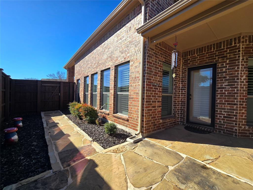 1800 Lancaster Gate Allen, TX 75013 - Photo 17 of 20 a view of house with backyard and sitting area