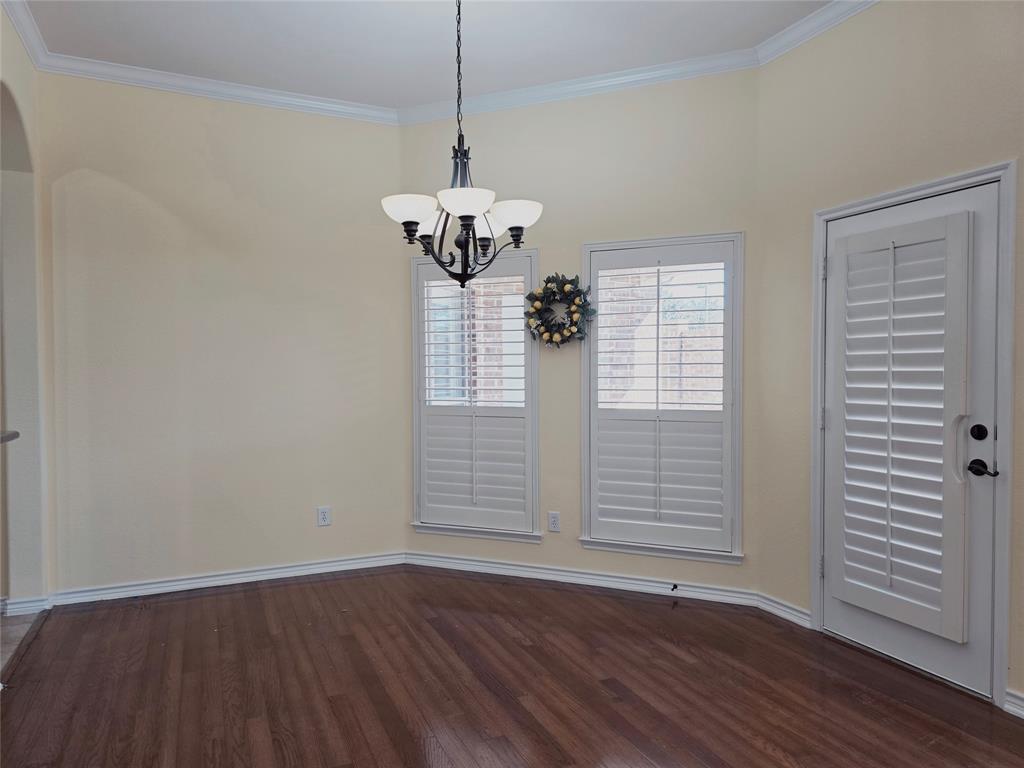 1800 Lancaster Gate Allen, TX 75013 - Photo 5 of 20 a view of an empty room with wooden floor and a window