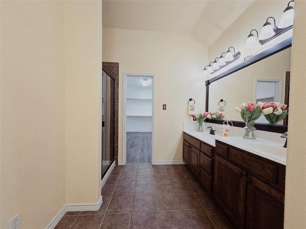 1800 Lancaster Gate Allen, TX 75013 - Photo 9 of 20 a kitchen with a sink and a refrigerator