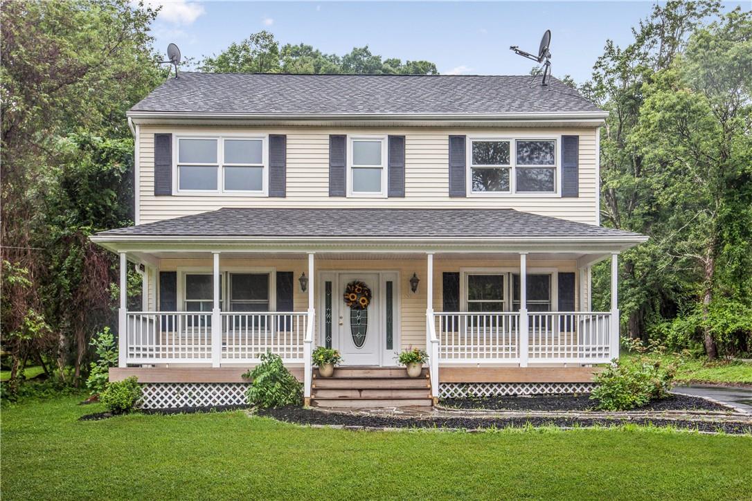 137 Chestnut Ridge Road Mahopac, NY 10541 - Photo 1 of 1 a front view of a house with a garden