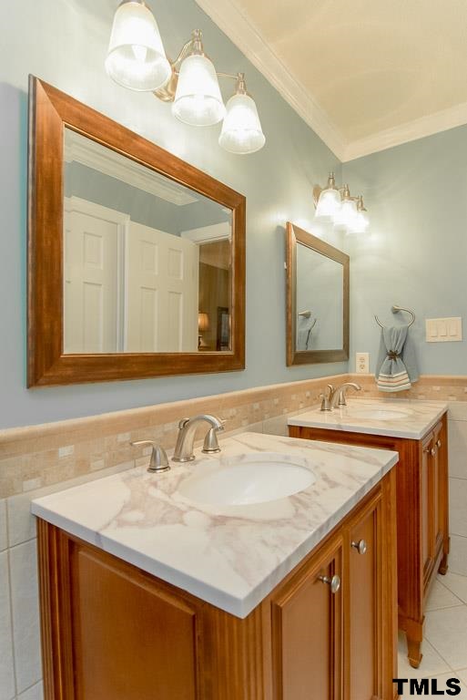 8101 Winstone Court Raleigh, NC 27615 - Photo 13 of 25 Designer vanities and tile floor accentuate this master spa bath.