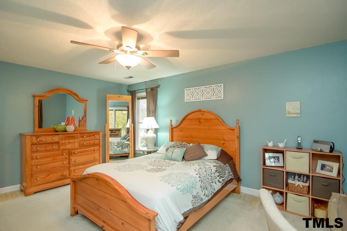 8101 Winstone Court Raleigh, NC 27615 - Photo 15 of 25 Light filled secondary bedroom with double door closet.