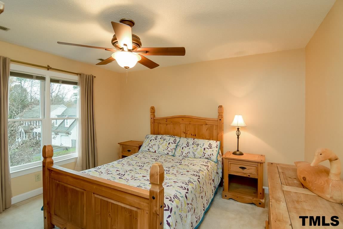 8101 Winstone Court Raleigh, NC 27615 - Photo 18 of 25 Secondary bedroom with ceiling fan.
