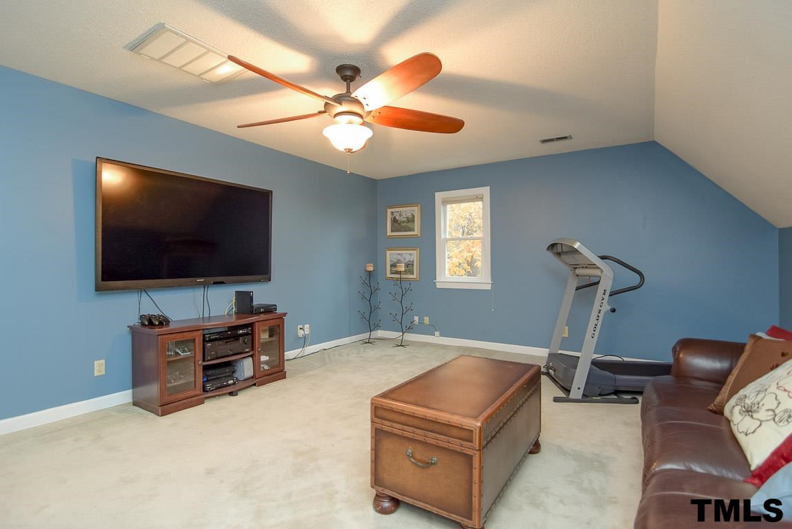 8101 Winstone Court Raleigh, NC 27615 - Photo 20 of 25 Spacious bonus room with ceiling fan.