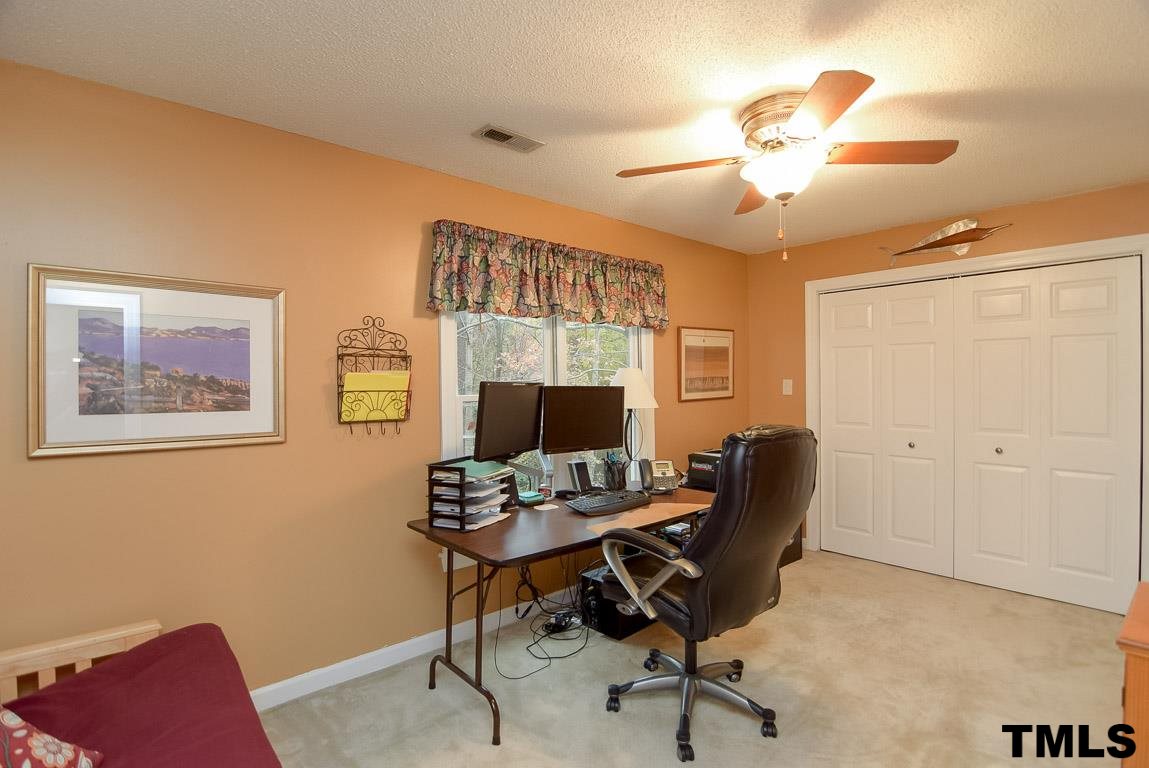 8101 Winstone Court Raleigh, NC 27615 - Photo 21 of 25 Secondary bedroom with double door closet currently used as an office.