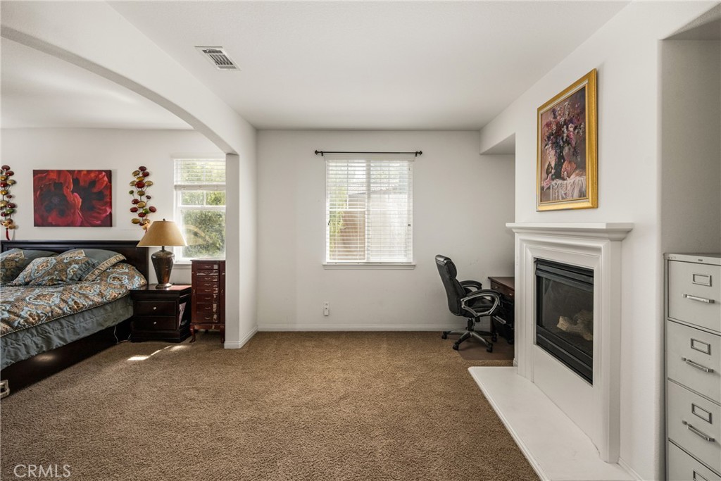 12652 Twin Peak Court Riverside, CA 92503 - Photo 22 of 55 a view of a bedroom with furniture and windows