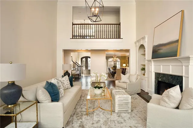 a kitchen with kitchen island white cabinets and stainless steel appliances