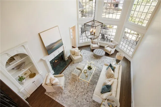 a kitchen with a sink a stove a refrigerator and white cabinets