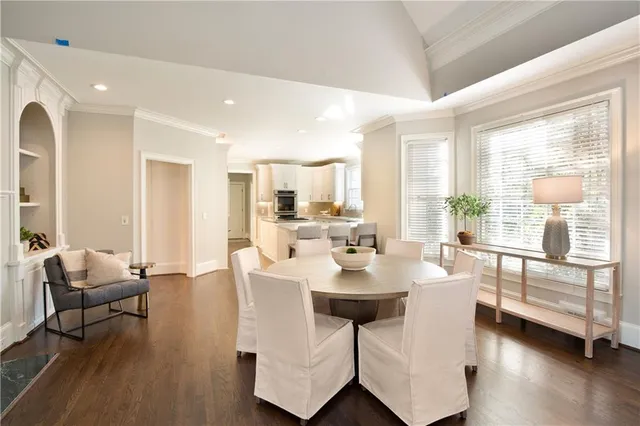 a spacious bedroom with a large bed and a dresser