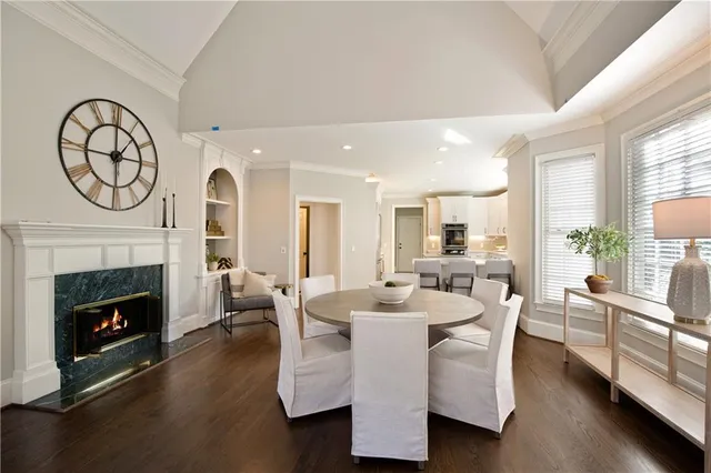 a bathroom with a tub a sink and a window