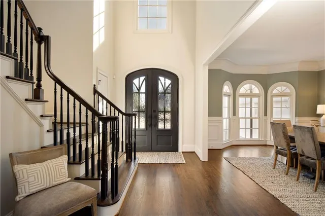 a view of a livingroom with furniture and hardwood floor