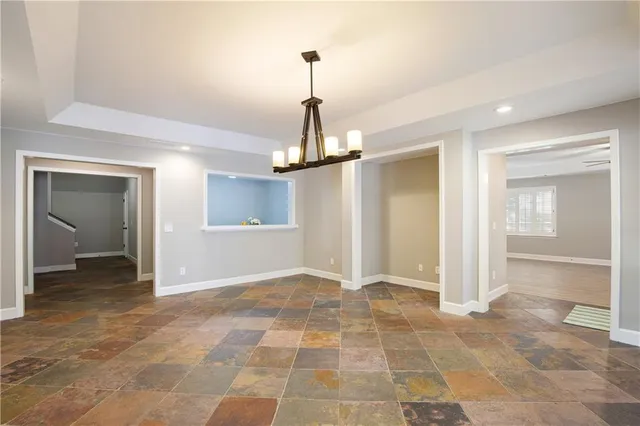 an aerial view of a houses with a yard