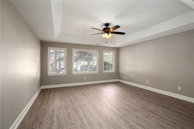 a view of a backyard with plants and outdoor seating