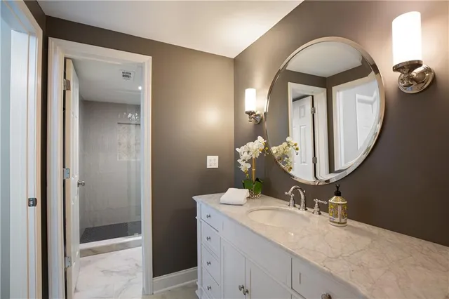 a view of a chairs and table in a balcony