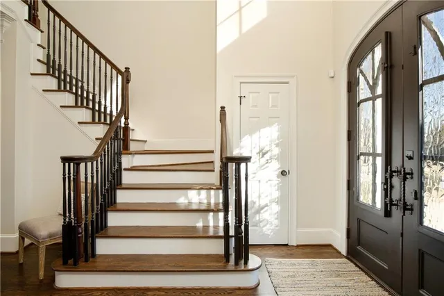 a dining room with furniture window and wooden floor