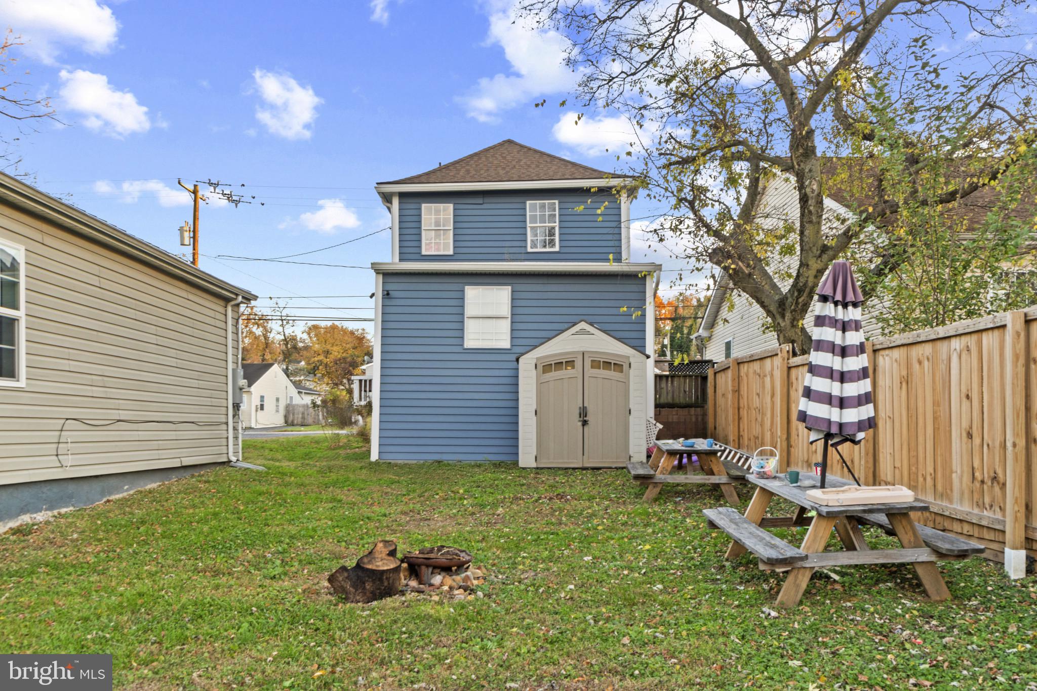 5904 Belle Grove Road Baltimore, MD 21225 - Photo 25 of 32 Back of house featuring a shed