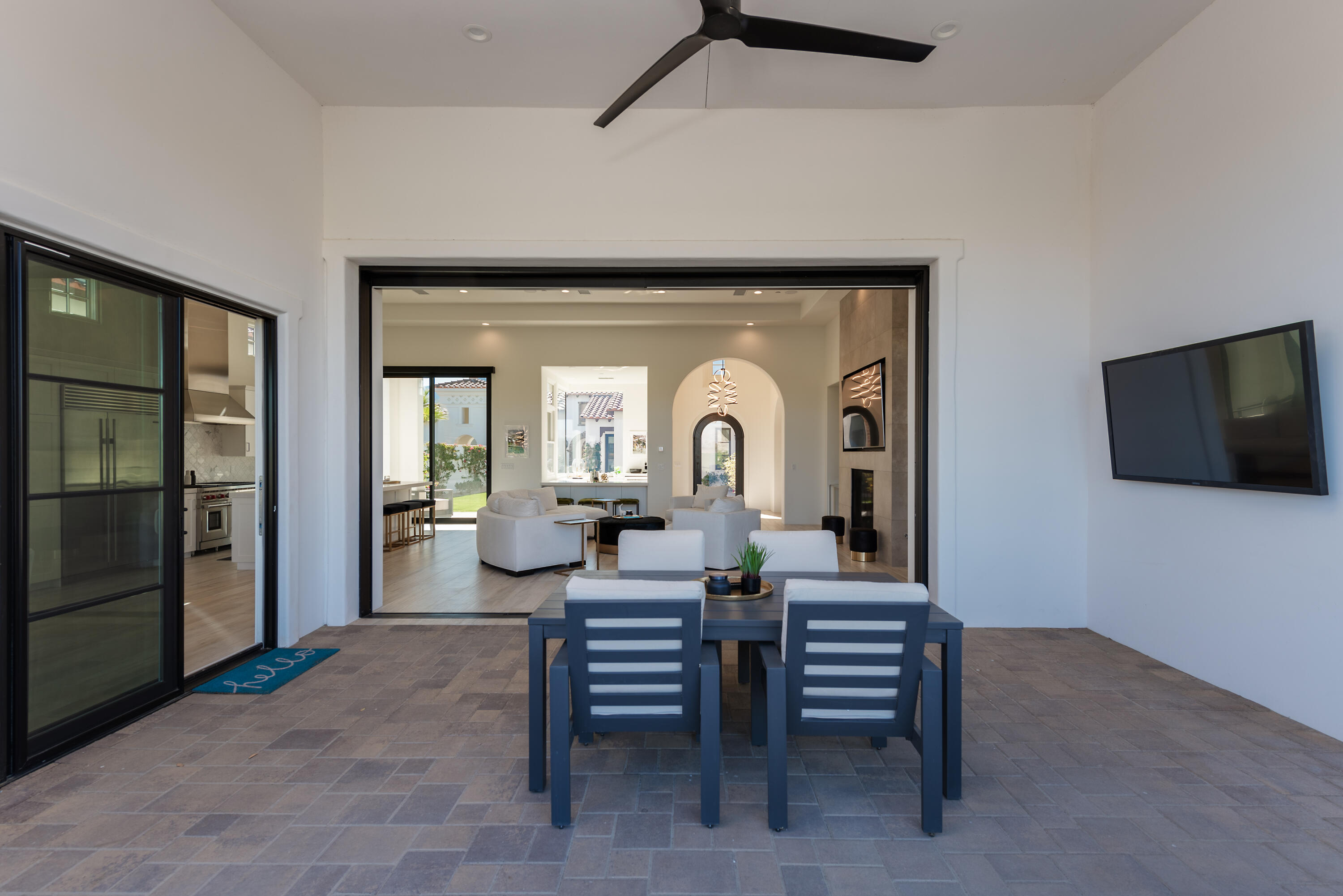 81660 Andalusia La Quinta, CA 92253 - Photo 13 of 36 a living room with furniture and a flat screen tv