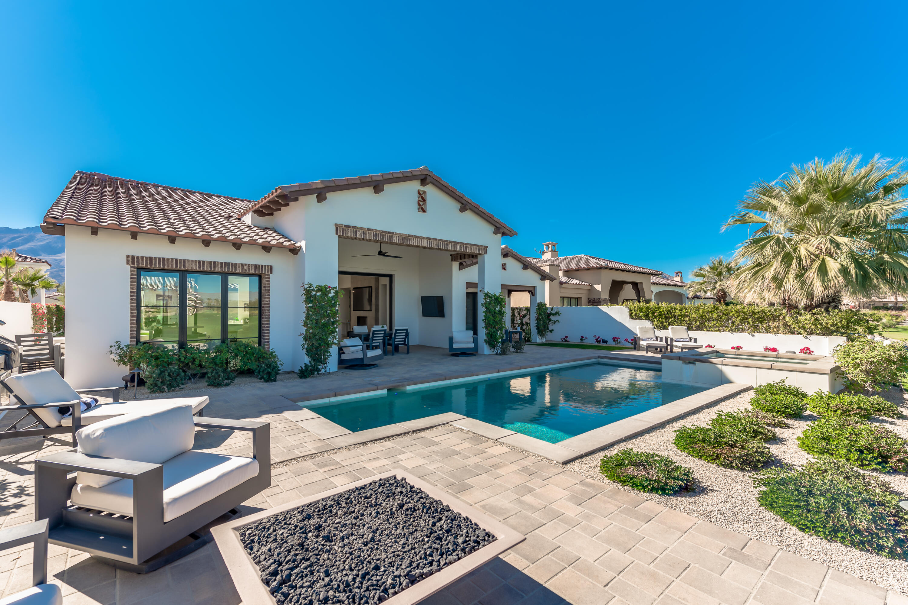 81660 Andalusia La Quinta, CA 92253 - Photo 15 of 36 a view of a house with backyard porch and patio