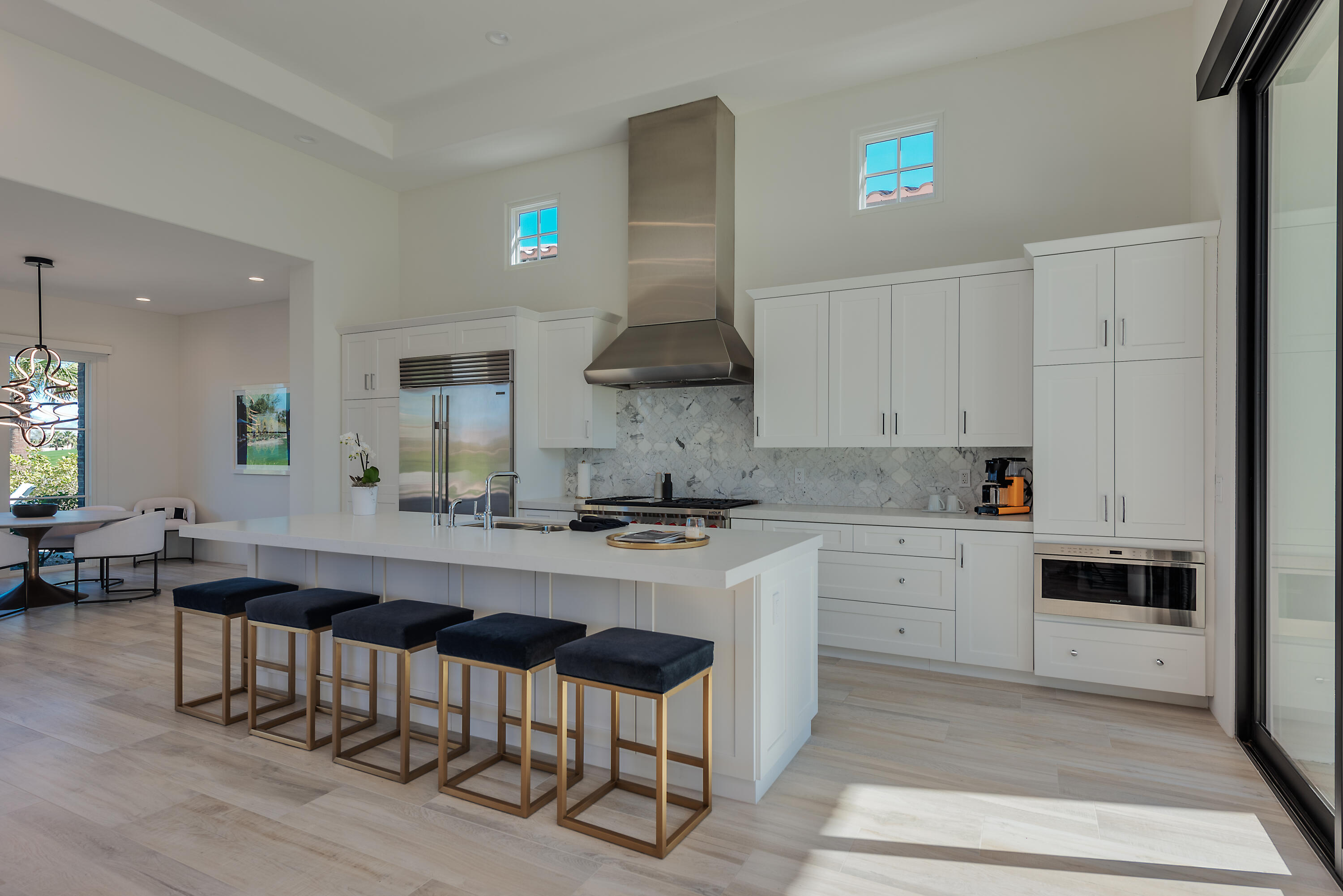 81660 Andalusia La Quinta, CA 92253 - Photo 17 of 36 a kitchen with granite countertop a sink stove and cabinets