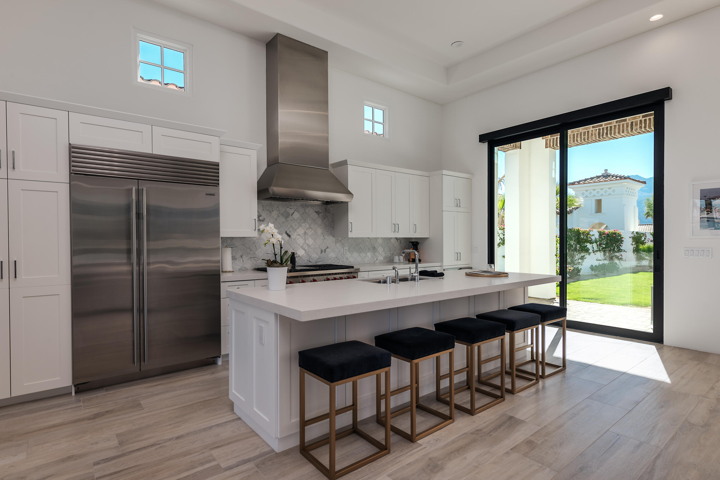 81660 Andalusia La Quinta, CA 92253 - Photo 18 of 36 a kitchen with stainless steel appliances a sink a stove and a refrigerator