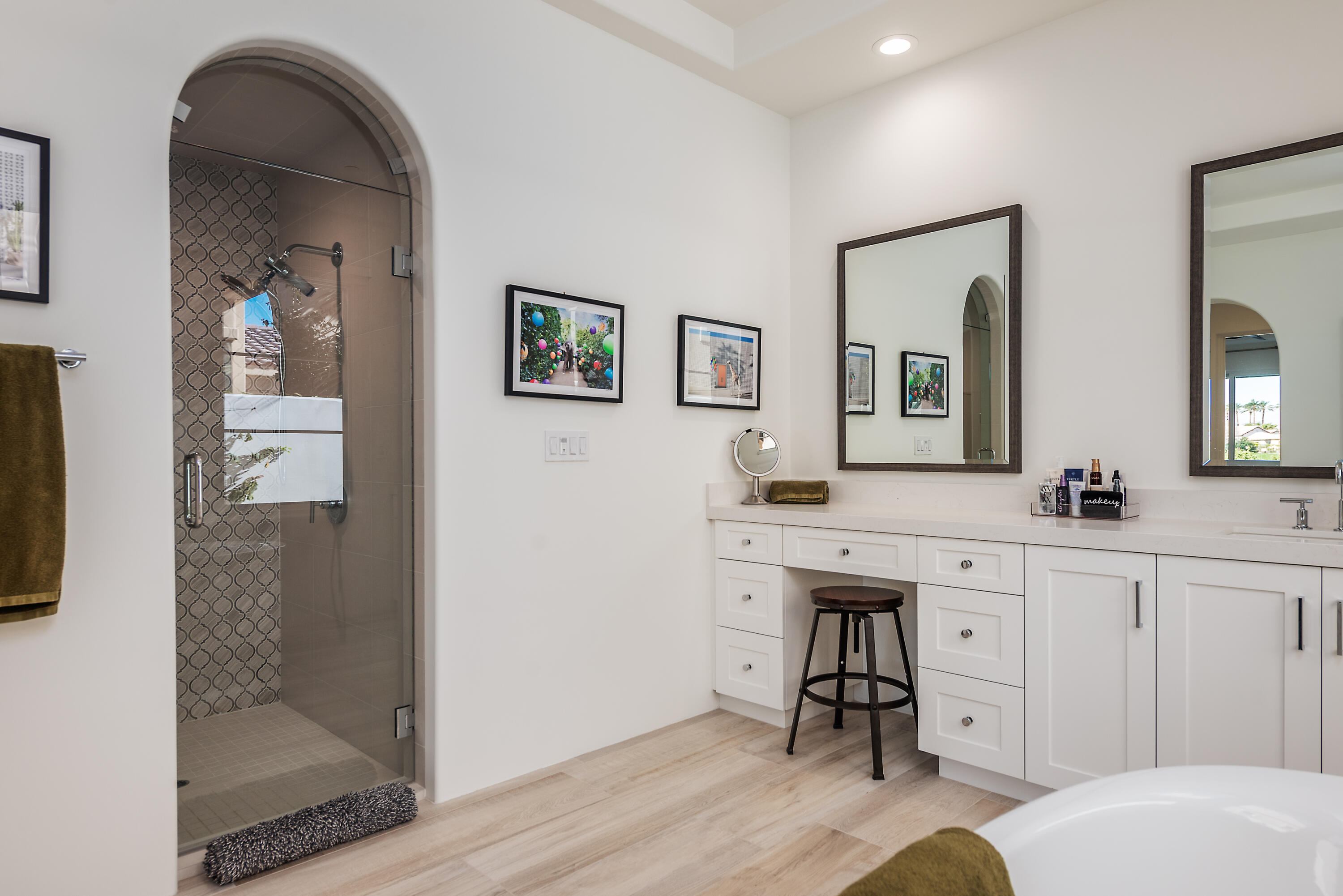 81660 Andalusia La Quinta, CA 92253 - Photo 23 of 36 a spacious bathroom with a toilet a sink a mirror and vanity