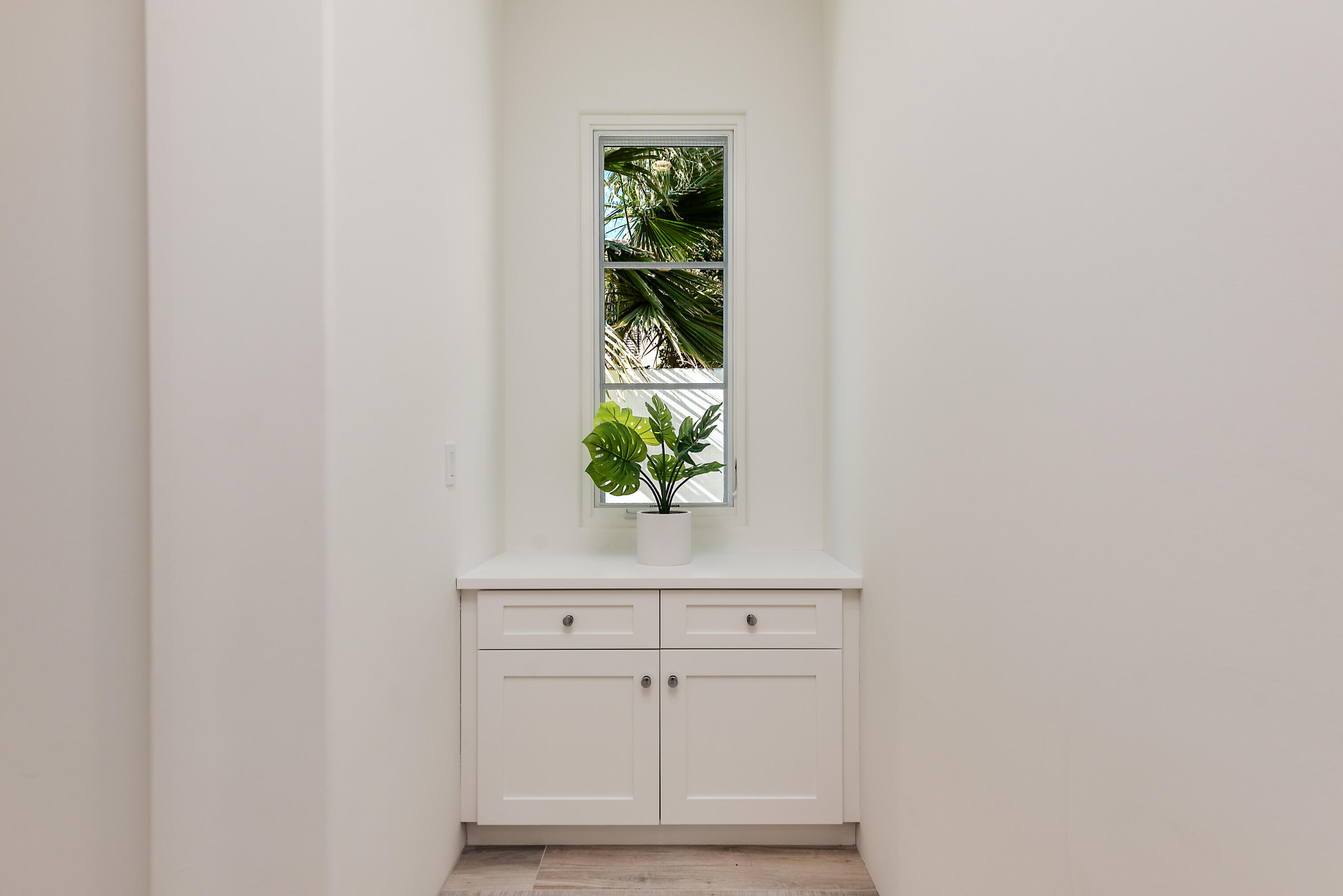 81660 Andalusia La Quinta, CA 92253 - Photo 28 of 36 close view of kitchen with white cabinets and window