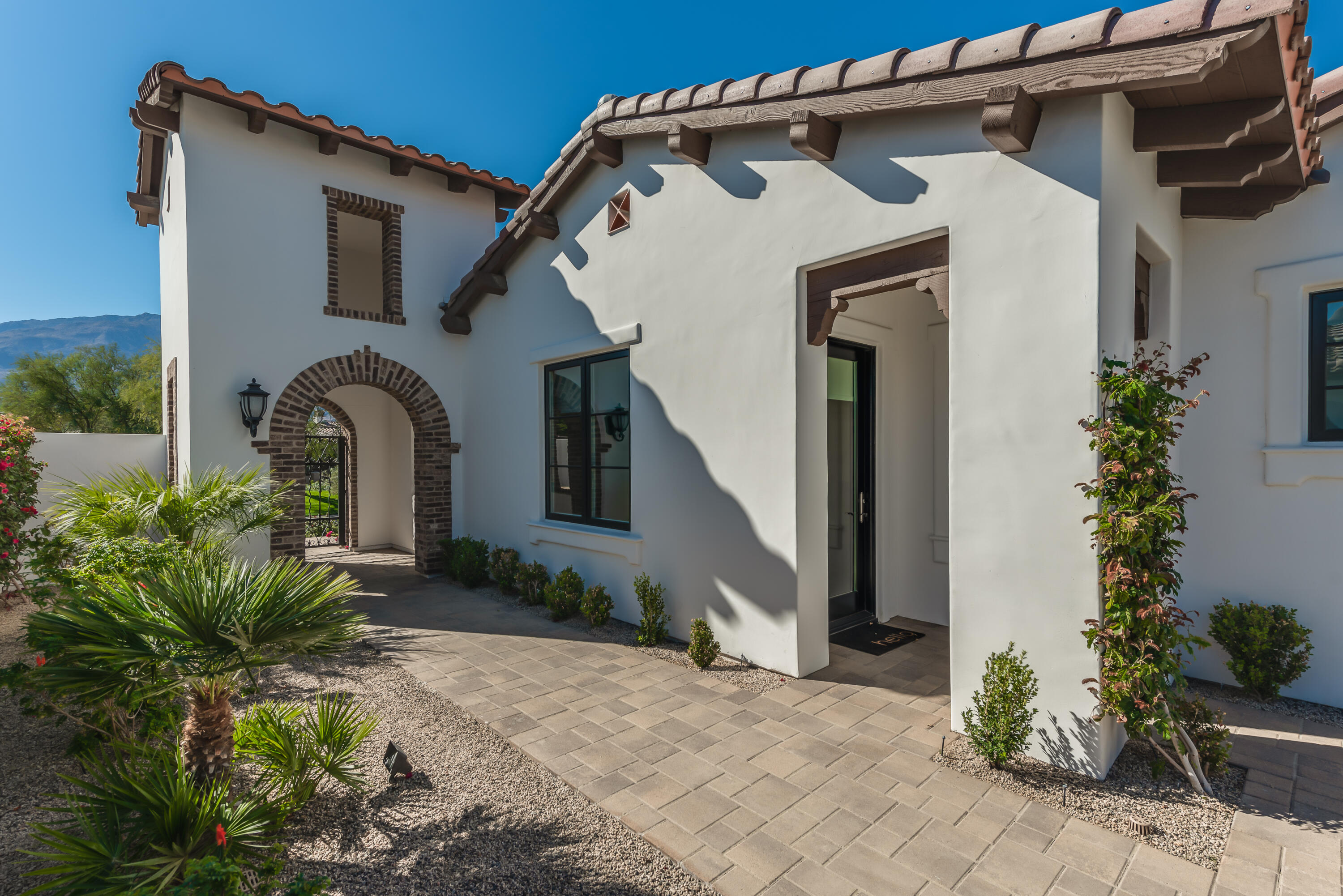 81660 Andalusia La Quinta, CA 92253 - Photo 3 of 36 a front view of a house with garden
