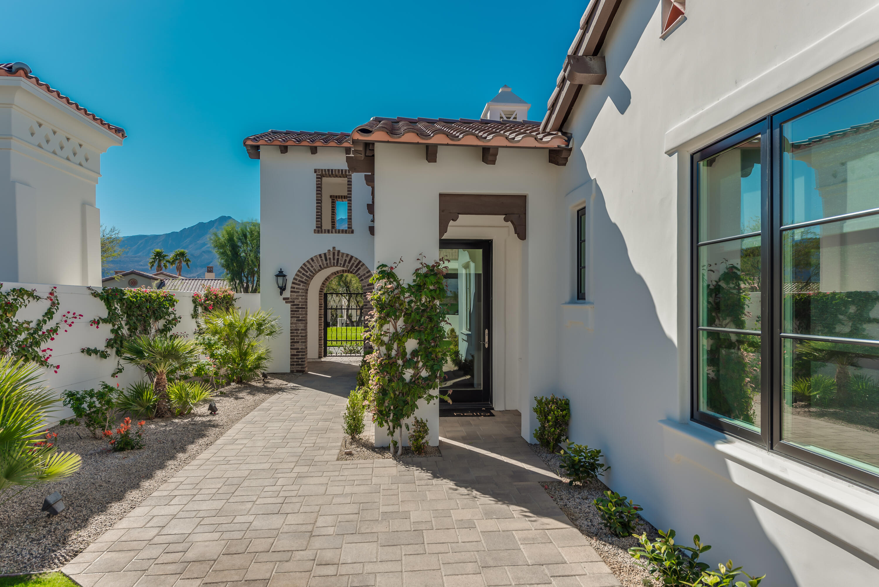 81660 Andalusia La Quinta, CA 92253 - Photo 4 of 36 a front view of a house with garden