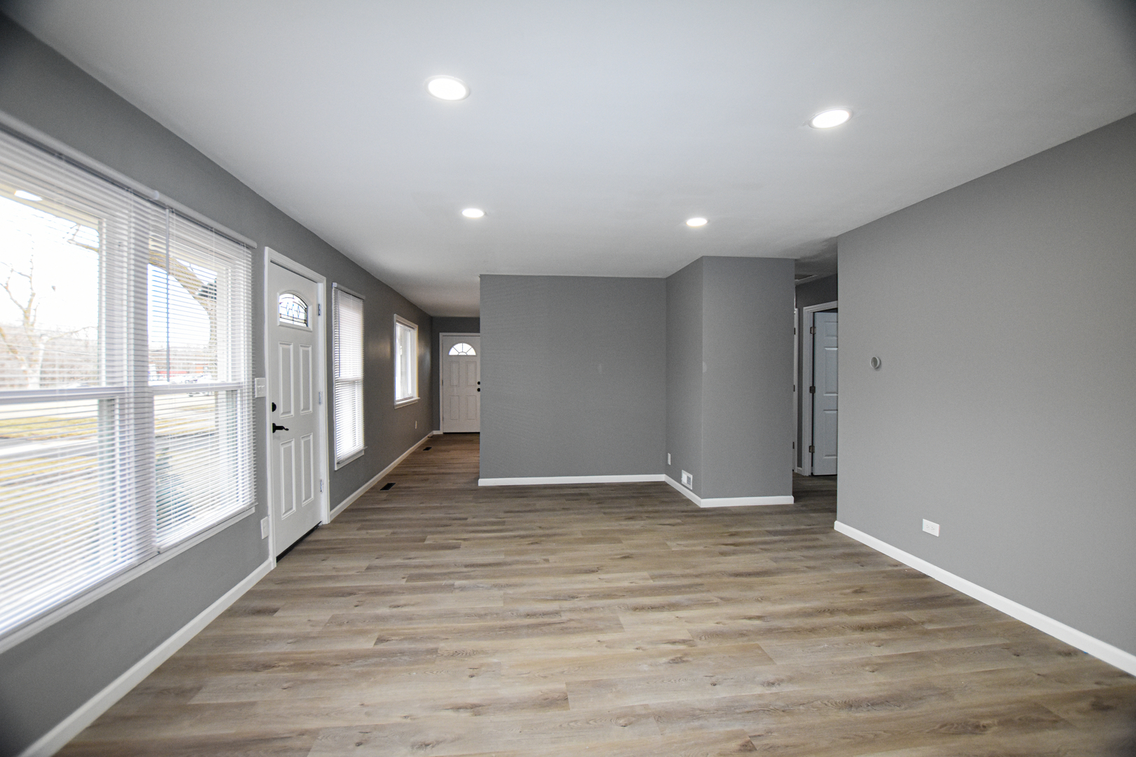 109 South Bartlett Road Streamwood, IL 60107 - Photo 12 of 39 a view of an empty room with wooden floor and a window