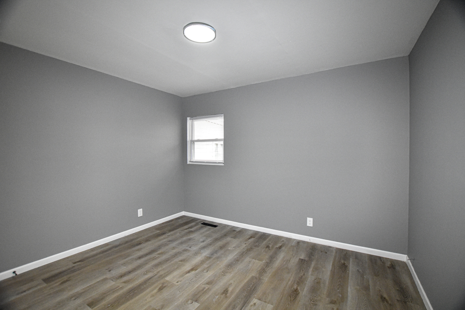 109 South Bartlett Road Streamwood, IL 60107 - Photo 15 of 39 an empty room with wooden floor and windows