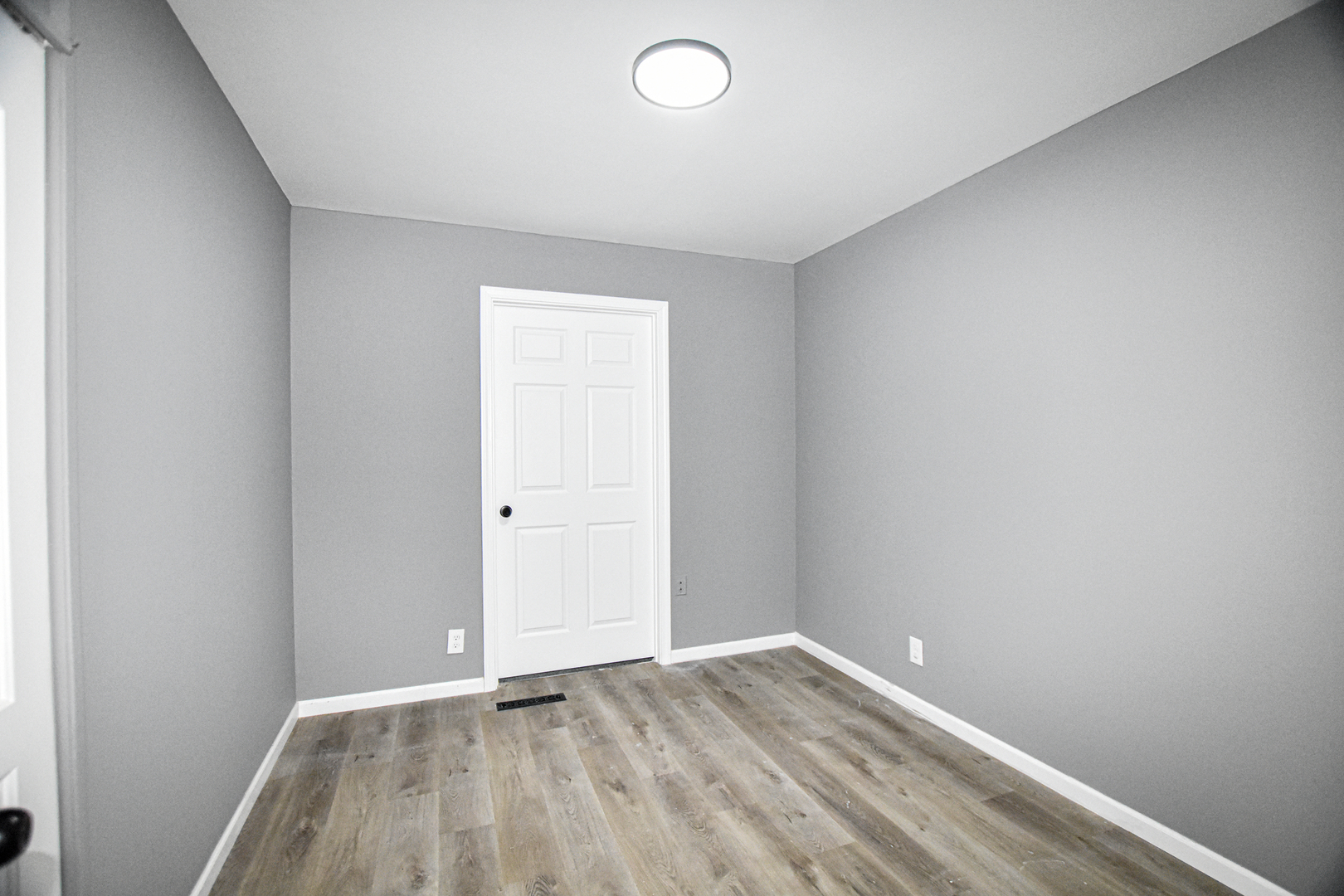 109 South Bartlett Road Streamwood, IL 60107 - Photo 18 of 39 a view of an empty room and wooden floor