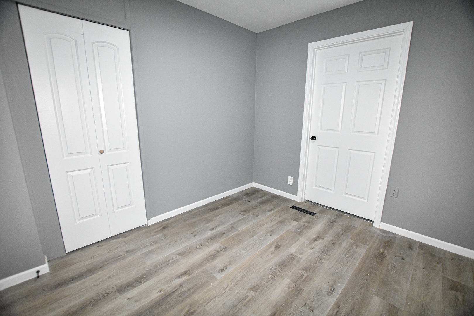 109 South Bartlett Road Streamwood, IL 60107 - Photo 19 of 39 a view of an empty room with wooden floor
