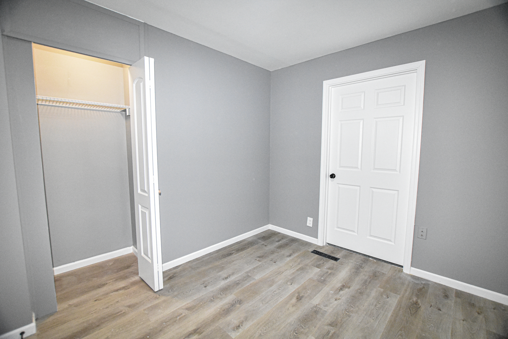 109 South Bartlett Road Streamwood, IL 60107 - Photo 20 of 39 an empty room with wooden floor closet and windows