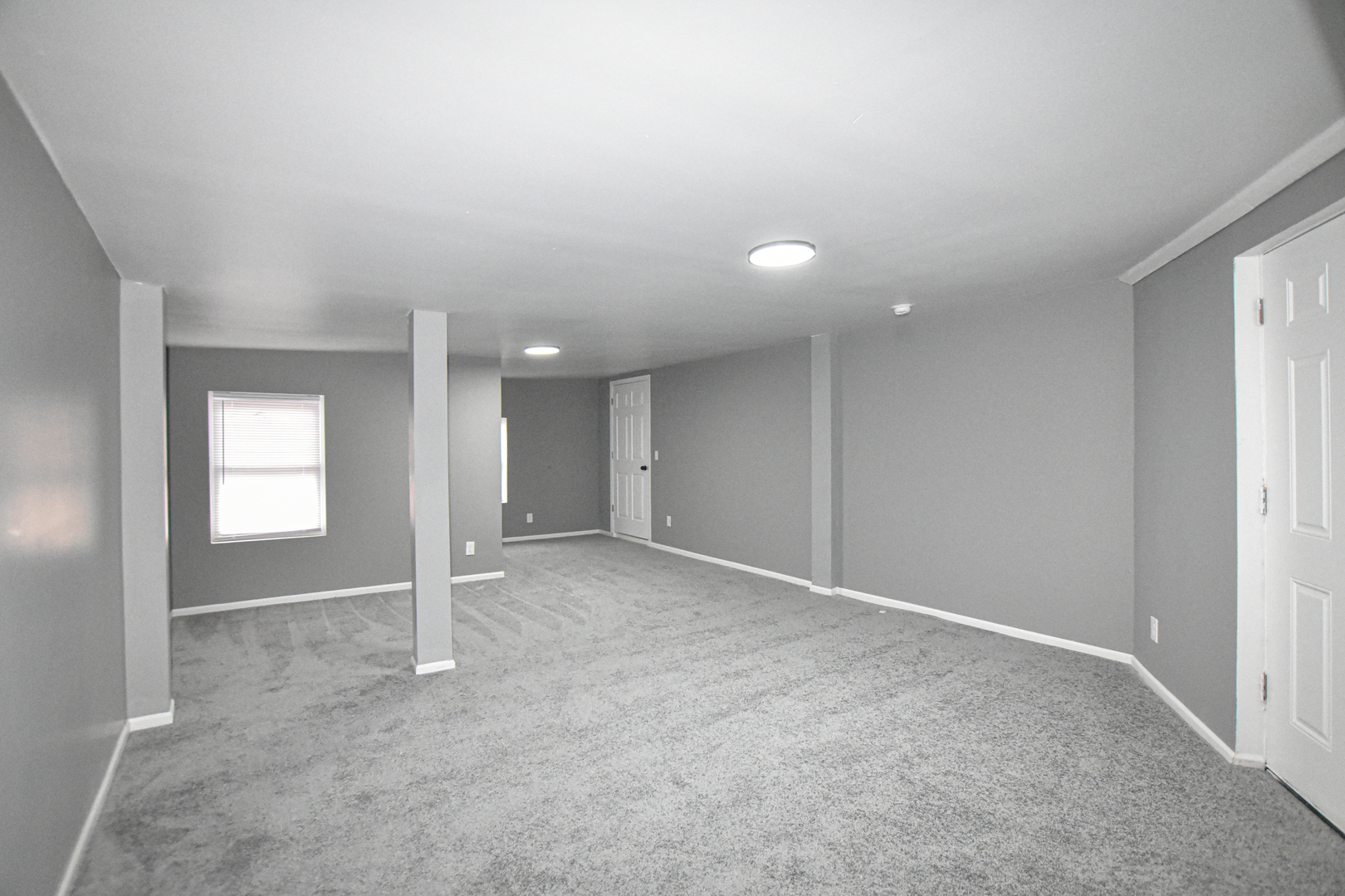 109 South Bartlett Road Streamwood, IL 60107 - Photo 27 of 39 an empty room with closet and windows