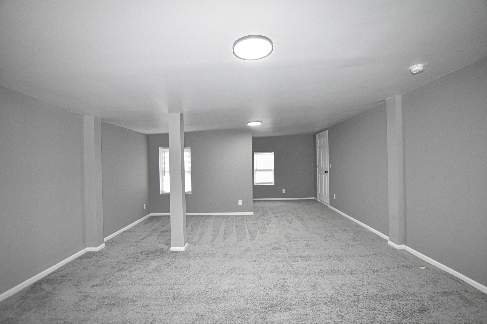 109 South Bartlett Road Streamwood, IL 60107 - Photo 28 of 39 a view of an empty room with window and wooden floor