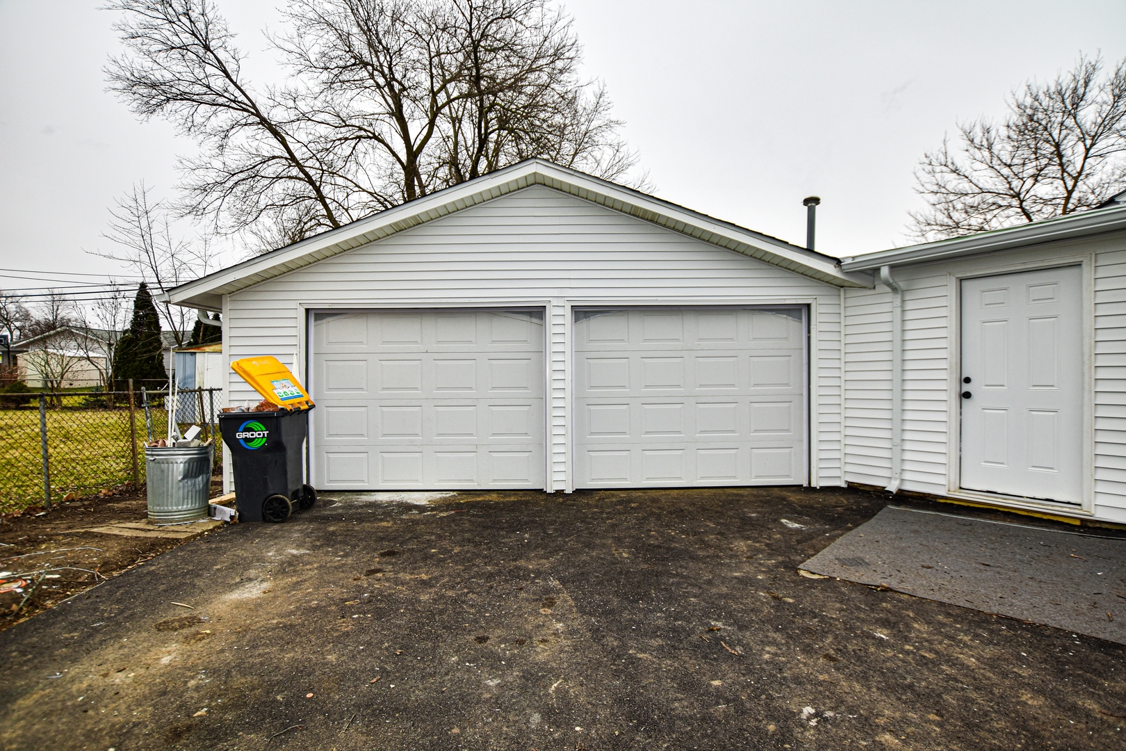 109 South Bartlett Road Streamwood, IL 60107 - Photo 5 of 39 a view of a house with a yard and garage